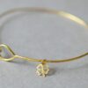 Fine Hammered Bangle with tiny Clover