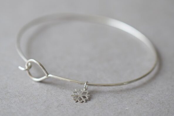Fine Hammered Bangle with tiny Snowflake